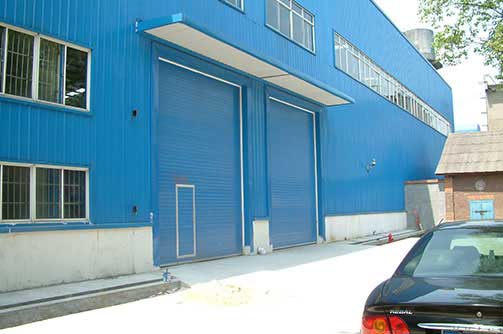 湘潭漣鋼工業(yè)提升門(mén)案例 - 中出網(wǎng)-智能出入口與停車充電門(mén)戶